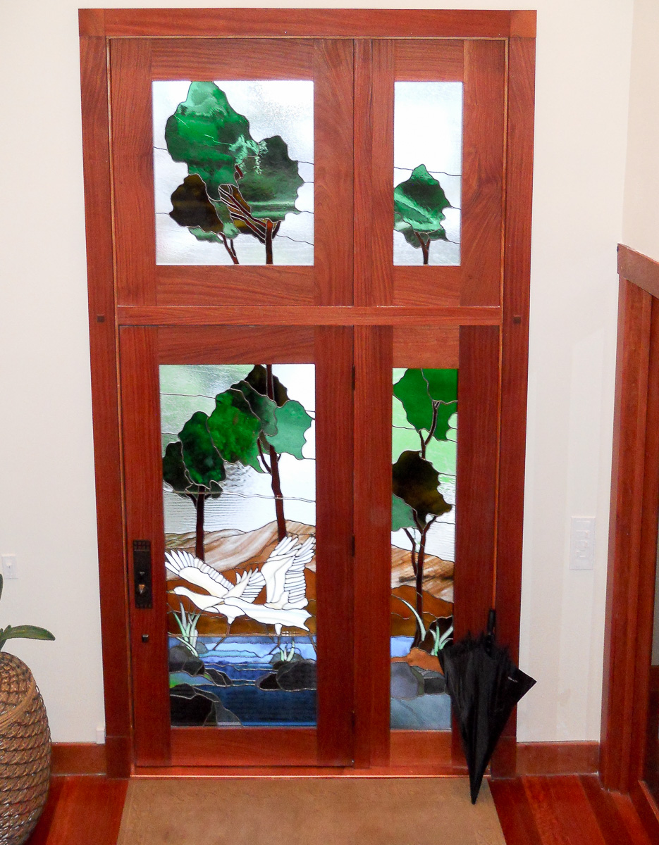 Custom Glass Door with hard wood combination.